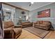 Cozy living room with rustic charm, featuring hardwood floors and comfortable seating at 119 Johnson St, Broadway, NC 27505