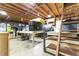 View of shed interior with shelving, storage containers, work bench, and ladder at 119 Johnson St, Broadway, NC 27505