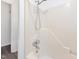 Bathroom features a shower with adjustable shower head and built-in shelving at 1204 Hydrangea Ct, Hillsborough, NC 27278