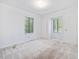 Bright bedroom with large windows and neutral carpet at 1204 Hydrangea Ct, Hillsborough, NC 27278