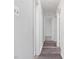 Hallway with hardwood flooring leading to rooms in the house at 1204 Hydrangea Ct, Hillsborough, NC 27278