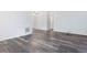 Bright living room with vinyl floors, neutral walls, and ample space at 1204 Hydrangea Ct, Hillsborough, NC 27278