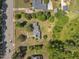 From above, view this home with its extensive green spaces, mature trees, and proximity to the main thoroughfare at 1213 Walnut St, Cary, NC 27511