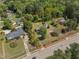 Aerial shot of the property highlighting the home's layout, lot size, and surrounding greenery at 1213 Walnut St, Cary, NC 27511