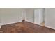 Spacious bedroom with hardwood floors and access to another room at 1213 Walnut St, Cary, NC 27511