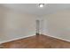 An airy bedroom with hardwood floors has natural light and a closet at 1213 Walnut St, Cary, NC 27511