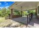 Spacious carport area with brick support columns and convenient access to backyard at 1213 Walnut St, Cary, NC 27511