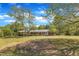 Charming brick home with a covered carport and mature trees at 1213 Walnut St, Cary, NC 27511
