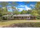 Charming brick home with a covered carport and beautiful landscaping at 1213 Walnut St, Cary, NC 27511
