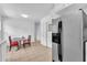 Kitchen features stainless refrigerator and a small dining area at 1213 Walnut St, Cary, NC 27511