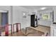 Spacious eat-in kitchen with white cabinets, stainless steel appliances, and tile flooring at 1213 Walnut St, Cary, NC 27511