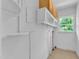 Bright laundry room with utility sink and plenty of storage space at 1213 Walnut St, Cary, NC 27511