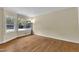 Living room with hardwood floors, natural lighting, and minimalist trim at 1213 Walnut St, Cary, NC 27511