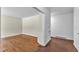 Empty living room featuring hardwood floors and neutral paint at 1213 Walnut St, Cary, NC 27511