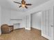 A paneled room with ceiling fan and a fireplace at 1213 Walnut St, Cary, NC 27511