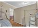 Room with a variety of shelving, ironing board, and natural light at 1213 Walnut St, Cary, NC 27511