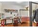 Craft room with storage, sewing machine, and work table with a red chair at 1213 Walnut St, Cary, NC 27511