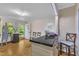 Bright room featuring a countertop, wood floors, and a door to the outside at 1213 Walnut St, Cary, NC 27511