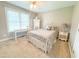 Bedroom with ceiling fan, a large window, a bed, and a vanity at 122 American Rd, Timberlake, NC 27583