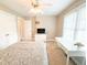 Bedroom with a large window, white furniture, and closet at 122 American Rd, Timberlake, NC 27583