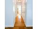 Hallway view leading to the ensuite bathroom featuring a soaking tub at 122 American Rd, Timberlake, NC 27583