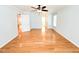 Spacious main bedroom with a ceiling fan, light walls, and hardwood flooring at 122 American Rd, Timberlake, NC 27583
