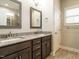 Bathroom with double sink vanity, granite countertops, and framed mirrors at 125 Claymore Dr, Clayton, NC 27527