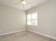 Cozy bedroom with carpet floors, ceiling fan, and bright window at 125 Claymore Dr, Clayton, NC 27527