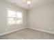 Bedroom with ceiling fan, carpet floors, and a large window at 125 Claymore Dr, Clayton, NC 27527