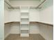 Walk-in closet with rods and shelving at 125 Claymore Dr, Clayton, NC 27527