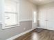 Bright foyer with wood floors, window, and closet for storage at 125 Claymore Dr, Clayton, NC 27527