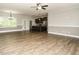 Spacious living room open to kitchen area with stainless steel appliances at 125 Claymore Dr, Clayton, NC 27527