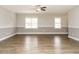 Spacious living room with hardwood flooring, and large bright windows at 125 Claymore Dr, Clayton, NC 27527