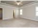 Spacious main bedroom with tray ceiling and carpeted floors at 125 Claymore Dr, Clayton, NC 27527