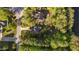 Aerial of houses with trees, driveways, and streets in a neighborhood at 128 Waterleaf Pl, Clayton, NC 27527