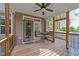 Covered back deck with wooden floors and railings and outdoor furniture at 128 Waterleaf Pl, Clayton, NC 27527
