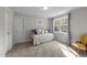 Bedroom featuring a day bed, pillows, and a window letting in light at 128 Waterleaf Pl, Clayton, NC 27527