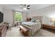 Bedroom with natural light, ceiling fan, neutral walls, and carpeted floors at 128 Waterleaf Pl, Clayton, NC 27527