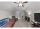Bonus room with a ceiling fan, window, tv, and neutral carpet at 128 Waterleaf Pl, Clayton, NC 27527