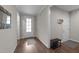 Inviting entryway with hardwood floors, a white door, and modern decor at 128 Waterleaf Pl, Clayton, NC 27527