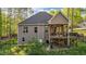 Cozy home featuring a covered deck, perfect for outdoor gatherings and enjoying the serene surroundings at 128 Waterleaf Pl, Clayton, NC 27527
