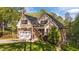 Charming home featuring a two-car garage, manicured lawn, and tasteful landscaping at 128 Waterleaf Pl, Clayton, NC 27527