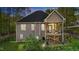 Rear exterior view with a raised wooden deck and fenced yard at 128 Waterleaf Pl, Clayton, NC 27527