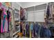 Spacious walk-in closet with built-in shelving and ample hanging space at 128 Waterleaf Pl, Clayton, NC 27527