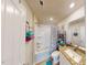 Bright bathroom with a granite counter, shower, and ample storage for convenience at 135 Shallow Dr, Youngsville, NC 27596