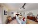 Cozy bedroom featuring a ceiling fan, neutral walls, and a comfortable rocking chair at 135 Shallow Dr, Youngsville, NC 27596