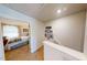 Comfortable bedroom seen from the hallway, featuring a neutral color palette and ample natural light at 135 Shallow Dr, Youngsville, NC 27596