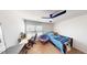 A simply decorated bedroom featuring a ceiling fan and a comfortable round chair at 135 Shallow Dr, Youngsville, NC 27596