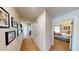 Hallway with wall decor and easy access to the bedroom, creating a warm and inviting path at 135 Shallow Dr, Youngsville, NC 27596