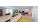 Open-concept layout with modern kitchen open to a living area, perfect for entertaining at 135 Shallow Dr, Youngsville, NC 27596